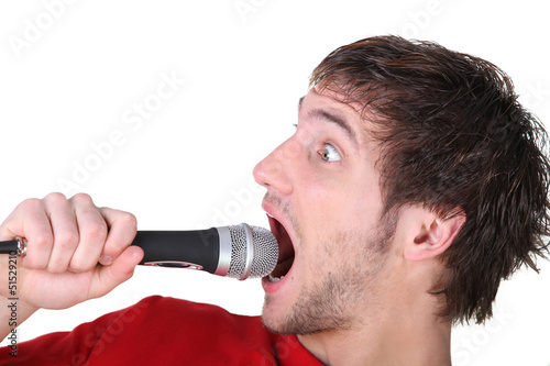 Photo: Man shouting into a microphone Man shouting into a microphone
