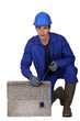 Bricklayer in blue overalls