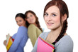 Photo: Young women with files Young women with files