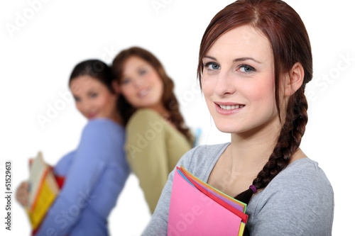 Photo: Young women with files Young women with files
