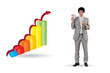 Businessman standing by bar chart holding cash
