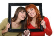 Two girls behind black frame