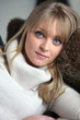 portrait of blond woman lying on a sofa
