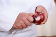 Photo: Male hands peeling onions Male hands peeling onions