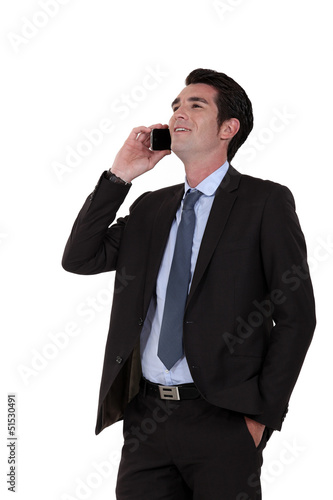 Photo: Businessman laughing on the phone Businessman laughing on the phone