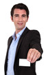 A businessman handing his card.