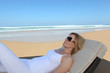 Woman lying on a lounger