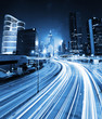 traffic light through city at night