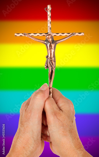Photo: Old woman with catholic crucifix, isolated, rainbow flag pattern Old woman with catholic crucifix, isolated, rainbow flag pattern