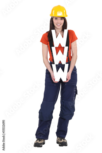 Photo: A female construction worker holding a WWW sign. A female construction worker holding a WWW sign.