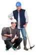 Photo: Experienced tradesman posing with his new apprentice Experienced tradesman posing with his new apprentice