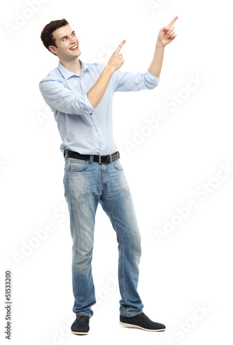 Photo: Young guy pointing up Young guy pointing up