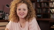 Portrait of young smiling woman, tracking shot