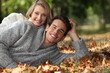 Couple lying in the leaves