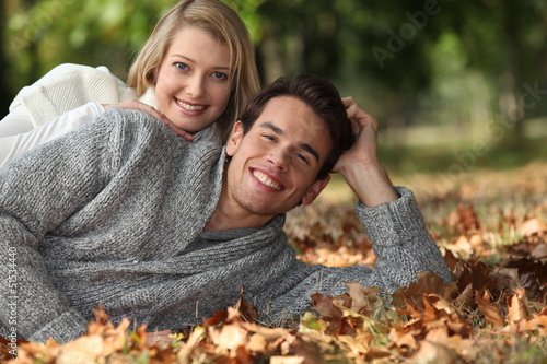 Photo: Couple lying in the leaves Couple lying in the leaves