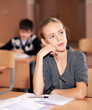 school girls sitting at their desk