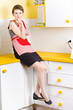 Thoughtful woman in kitchen
