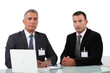 Photo: Two businessman at work. Two businessman at work.