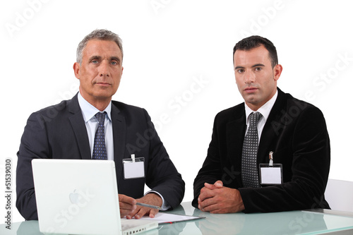 Photo: Two businessman at work. Two businessman at work.