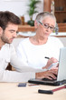 Man helping elderly lady