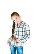 girl with long braid in a plaid shirt and jeans