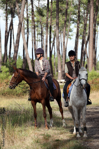 Photo: man and woman riding horses man and woman riding horses