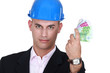 A male architect with his hand full of cash.