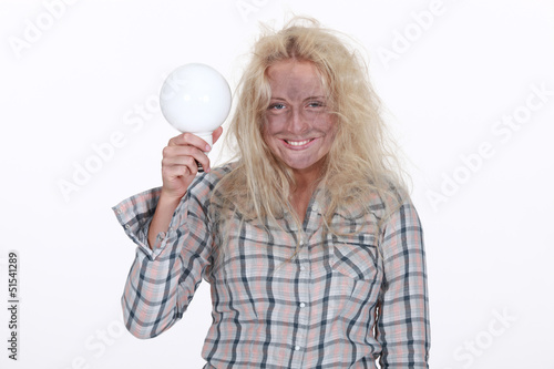 Photo: female electrician burnt after shock holding a bulb female electrician burnt after shock holding a bulb