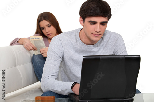 Photo: Couple relaxing at home Couple relaxing at home