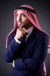 Arab businessman in dark studio