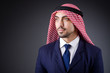 Arab businessman in dark studio