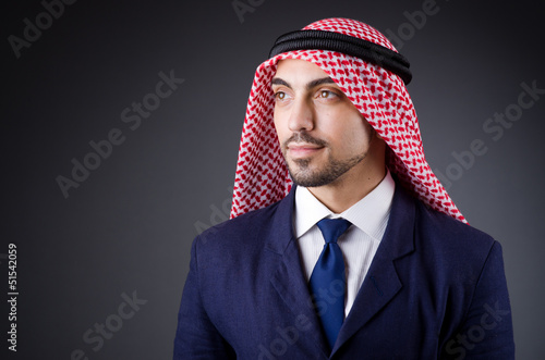 Photo: Arab businessman in dark studio Arab businessman in dark studio