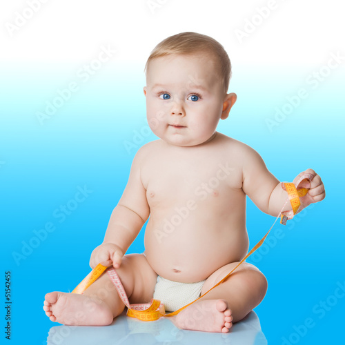 Photo: Adorable Baby Boy with a measuring tape. Adorable Baby Boy with a measuring tape.