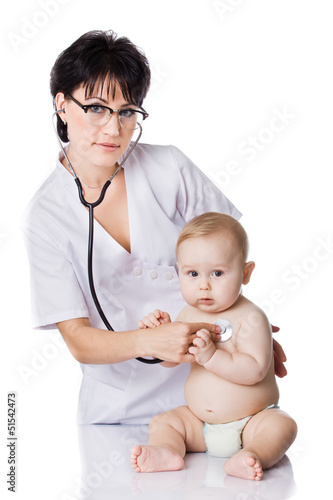 Photo: beautiful doctor and baby on a white background. beautiful doctor and baby on a white background.