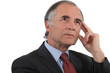 Photo: Middle-aged businessman searching for inspiration Middle-aged businessman searching for inspiration