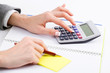 Hands working on the calculator