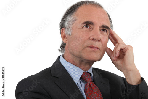 Photo: Middle-aged businessman searching for inspiration Middle-aged businessman searching for inspiration