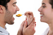 A woman feeding her man.