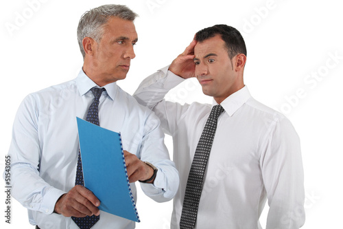 Photo: Boss reprimanding his employee Boss reprimanding his employee