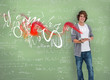 Photo: Smiling boy posing in front of chalk board Smiling boy posing in front of chalk board