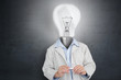 Man with lit up bulb for a head
