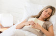Tired woman reading a book