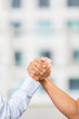 Photo: Business people arm wrestling Business people arm wrestling