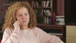 Young girl talking on a mobile phone, tracking shot