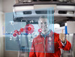 Photo: Mechanic showing thumbs up with futurist interface Mechanic showing thumbs up with futurist interface