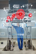 Smiling mechanic standing under futuristic interface