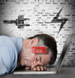 Photo: Businessman sleeping on laptop with energy and charging symbols Businessman sleeping on laptop with energy and charging symbols