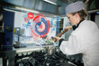 Chef adding pepper to her soup