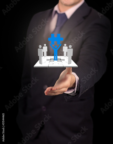 Photo: businessman showing a handshake to the camera businessman showing a handshake to the camera
