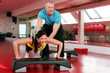 Couple working out in a fitness gym